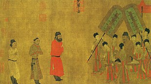 Painting of three men in respectful posture approaching a man seated on a palanquin and surrounded by attendants on the left