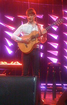 Eirik playing concert with Kings of Convenience