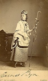 Boulton, dressed as a shepherdess, holding a crook
