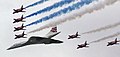 Image 70Concorde (and the Red Arrows with their trail of red, white and blue smoke) mark the Queen's Golden Jubilee. With its slender delta wings Concorde won the public vote for best British design. (from Culture of the United Kingdom)