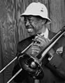 Image 14 Al Grey Photograph credit: William P. Gottlieb; restored by Adam Cuerden Al Grey (June 6, 1925 – March 24, 2000) was an American jazz trombonist who was known for his plunger-mute technique. After serving in World War II, he joined Benny Carter's band, then the bands of Jimmie Lunceford, Lucky Millinder, and Lionel Hampton. In the 1950s, he was a member of the big bands of Dizzy Gillespie and Count Basie before forming his own bands in the 1960s. This photograph by William P. Gottlieb shows Grey still performing into the 1980s. More selected portraits