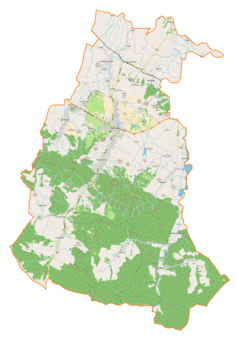 Mapa konturowa gminy Rymanów, blisko centrum u góry znajduje się punkt z opisem „Rymanów, synagoga”