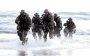 A SEAL Team coming out of water