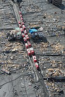 Emergency vehicles staging in the ruins of Otsuchi following the tsunami