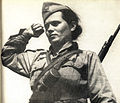 The raised fist was the official salute of communist partisan armies throughout the Balkans during World War II, as performed by this Yugoslav partisan.