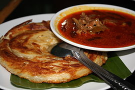 Roti cane with goat curry served in a Riau restaurant