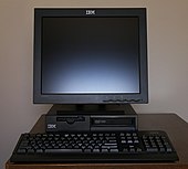 Black desktop computer with monitor on top and keyboard in front