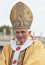 Pope Benedict XVI. The Pope traditionally wears gold and white outside St. Peter's Basilica.