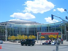 photo showing the semi-circular entrance to the America West Arena in downtown Phoenix, blue sky in background