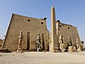 Entrance of the Luxor Temple, western façade; a pair of obelisks usually stood in front of a pylon; the 2nd obelisk (the Luxor Obelisk, 23 metres (75 ft) high, not shown) had been moved to France.