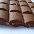 Milk chocolate contains milk and lower levels of cocoa solids.