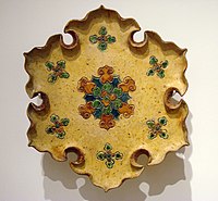 A Tang sancai-glazed lobed dish with incised decorations, 8th century