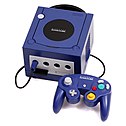 Purple video game console with attached controller