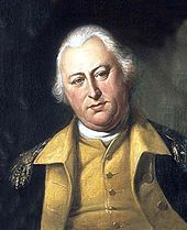 A portly, white-haired man wearing a black jacket with gold epaulets, a gold vest, and a high collared, white shirt