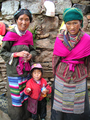 Two women at Drepung Monastery, Tibet, wearing U-Tsang chubas.