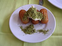 Tulumba with kaymak and pistachio