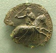 Partly ruined black seal, showing Edward III on horseback, in armour and sword raised