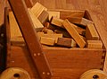 Image 12Wooden unit blocks, a type of toy block, in a wooden wagon (from List of wooden toys)
