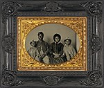 Sgt. Samuel Smith, African American soldier in Union uniform with wife and two daughters.jpg