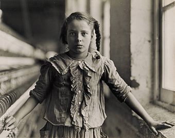 Lewis W. Hine, Adolescent Girl, a Spinner, in a Carolina Cotton Mill, 1908[56]