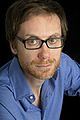 Image 9 Stephen Merchant Photo: Carolyn Djanogly Stephen Merchant (b. 1974) is an English writer, director, radio presenter, comedian, and actor. He is best known for his collaborations with Ricky Gervais, with whom he co-wrote and co-directed the popular British sitcom The Office, co-hosts The Ricky Gervais Show, and co-wrote, co-directed, and co-starred in Extras. More selected portraits