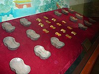 Molds for Chinese sycee, a form of silver and gold ingots used as currency under the empire.