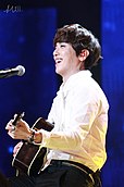 Jung Yong-hwa performing at the Top Chinese Music Awards