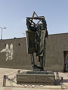 black metal memorial in an urban square