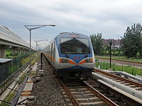 Most Beijing Subway rolling stock, such as this DKZ5 Line 13 train, run on 1,435 millimetres (56.5 in) standard gauge track, drawing 750V direct current (DC) electrical power from the third rail. Line 13, like most lines, use six-car Type-B train sets.