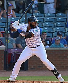 Courtney Hawkins waiting to receive a pitch at bat for the Lexington Legends.