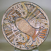A Manises plate, c. 1535. A fantastical owl wearing a crown, a characteristic Manises design during the first half of the 16th century
