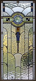 An Art Deco domestic casement window, Melbourne, Australia, shows a wide variety of textured glass with some streaky glass in muted colours.