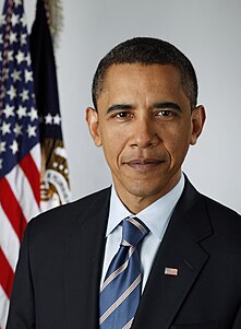 Photograph of Obama next to the American flag.