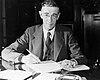 Vannevar Bush seated at his desk