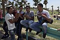 بعض الشباب المصريين يحتفلون في عيد الفطر بالغناء في إحدى الحدائق العامة.
