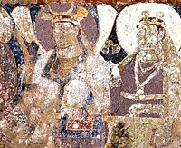 Probable Hepthalite rulers of Tokharistan, with single-lapel caftan and single-crescent crown, in the lateral row of dignitaries next to the Sun God.[33][34][29]