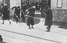 Jews forced to shovel snow from the street in Kraków.jpg