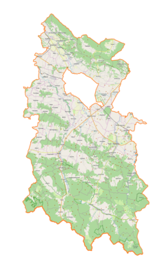 Mapa konturowa powiatu krośnieńskiego, po prawej znajduje się punkt z opisem „Rymanów, synagoga”