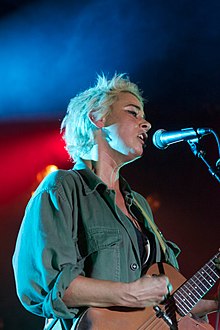 Cat Power singing into a microphone
