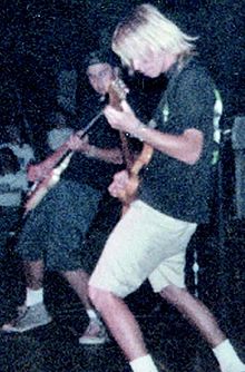 Adam Siegel on stage with Excel on tour in Netherlands in 1989