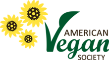 The words "AMERICAN Vegan SOCIETY" appear on the right of the logo, with "Vegan" in green. On the left side of the logo there are three yellow flowers with gears on the middle.