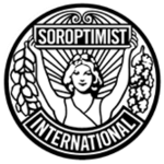 A circular, black and white logo with a style suggesting late Art Nouveau or early Art Deco. Soroptimist International describes it as follows: "The emblem consists of a circular disc on which the figure of a woman holds the banner 'Soroptimist' in uplifted arms, spreading sunrays from the background. [From] the banner on one side fall acorns and leaves of oak and on the other side, leaves of laurel. [The] word 'International' completes the outer circle."[1]