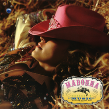 Close-up from left of Madonna laying down on a bale of hay, with her face partially covered by a pink cowboy hat. The song and artist name is written in a small box to the bottom-right, on either side of an icon of a riding cowboy.