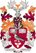 Coat of Arms of Mohawk College with primarily burgundy, crimson, and orange colours