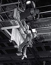 Alan Rickman hanging from a raised platform