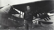 Picture of a man standing in front of a light aircraft